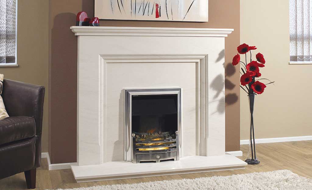 A traditional gas fire installed in a limestone fireplace