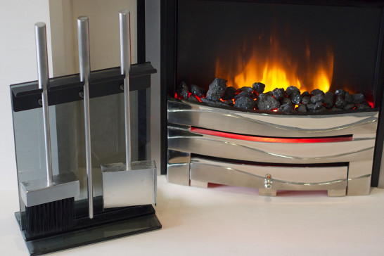 An electric fire with companion set